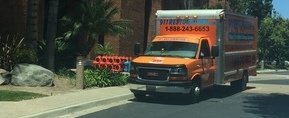 Water Damage and Mold Removal Truck Driving To Job Site