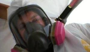 Mold Damage Restoration Technician With Mask